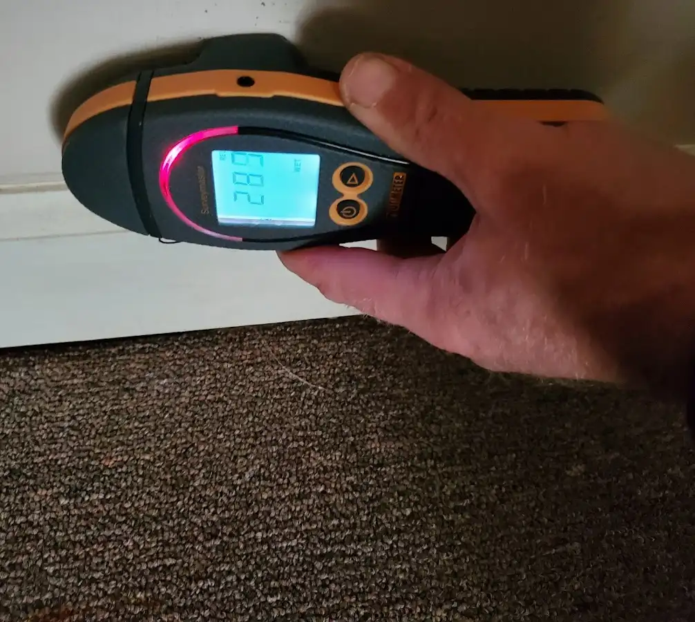 Moisture detection at baseboard during Storm Damage Restoration in Edmond